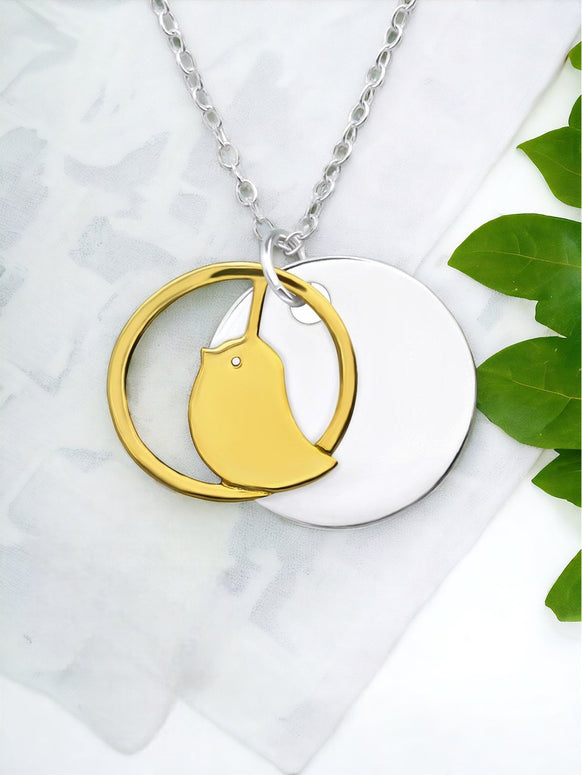 Sterling Silver Necklace With A Gold Bird Pendant